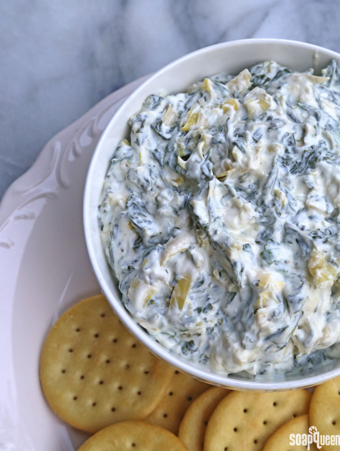 Made with fresh spinach, light Greek yogurt and light cream cheese, this Spinach and Artichoke Dip is always a hit at parties and gatherings!