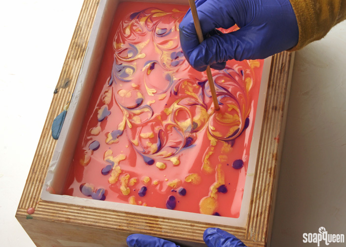 Mica painting is a great way to add color and sparkle to cold process soap. Learn how in this blog post!