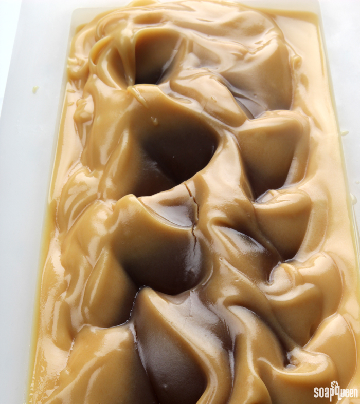 Learn how to work with honey in cold process soap, and see what happens when too much honey is added! The top of this soap is cracking due to the heat from the honey.