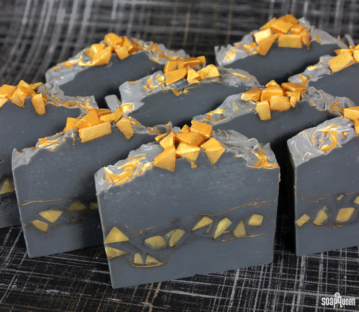 This Gold Mine Cold Process Soap is made with activated charcoal and gold mica to create stunning contrast. Learn how to make it in this blog post!