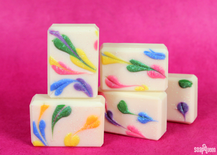 This Rainbow Heart Swirl Cold Process Soap features lots of color, glitter and smells like a tropical vacation!