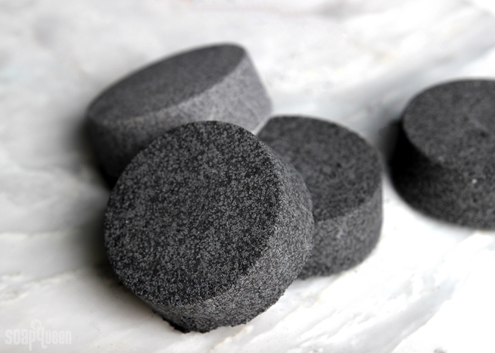 Black Bath Bombs: A Cautionary Tale // Black bath bombs have gone viral, but do they work? Several black bath bomb recipes are put to the test, including black bath bombs made with charcoal. 