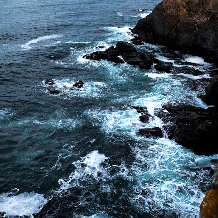 Waves Crash Into Rocks